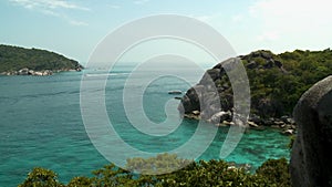 Overlooking a boat moving into an inlet