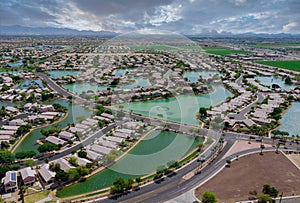 Overlooking desert of the many small ponds near Avondale a small town a of rugged mountains near of state capital Phoenix Arizona photo