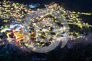 Overlooking the lively and colorful valley villages at night. Jiufen, Taiwan.