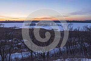 Overlooking snow covered minnesota river valley at dusk