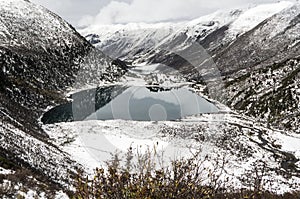 Overlooking the valley and snow-capped mountains of Kham Tibet