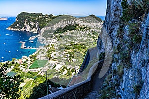 Overlooking view of Capri Island with Marina Grande harbor and Punta del Capo