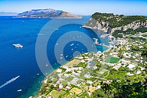 Overlooking view of Capri Island with Marina Grande harbor and Punta del Capo