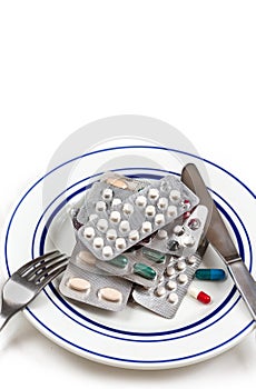 Overmedication -Capsules and hidden in a close-up plate with the broods.