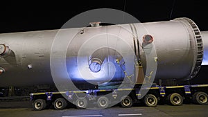 Overnight delivery of oversized cargo. A giant steel tank for the oil industry.