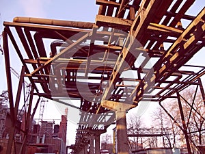 Overpass of the technological pipeline at sunset