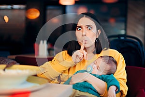 Mother Asking for Silence while Baby is Sleeping photo