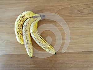 Overripe bunch of medium sized bananas isolated photo