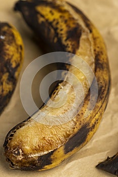 an overripe dark banana that is spoiling
