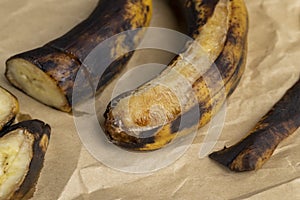 an overripe dark banana that is spoiling