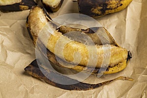 an overripe dark banana that is spoiling