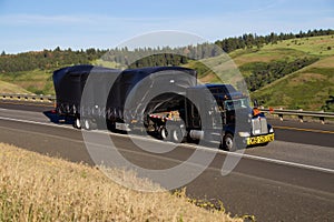 Oversize Load / Black Kenworth Semi-Truck