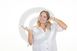 Oversize woman smiling making cell phone gesture with fingers and palm hand up show empty copy space blank