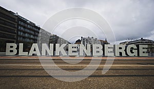 Oversized lifesize Blankenberge letters sign at north sea atlantic ocean in West Flanders Belgium