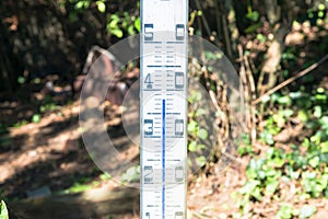 Oversized quicksilver thermometer in the blazing sun