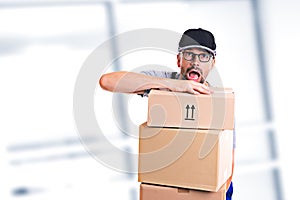 Overstrained postman with parcels