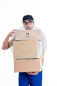 Overstrained postman with parcels photo