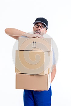 Overstrained postman with parcels photo