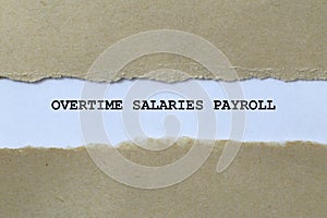 overtime salaries payroll on white paper