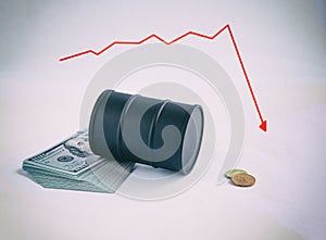 An overturned barrel of oil on dollars. diagram of falling oil prices in the form of a curve. global crisis