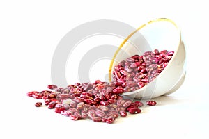 Overturned bowl with red haricot beans photo
