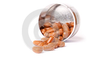 Overturned candy can isolated on a white.