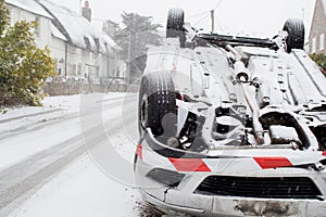 Overturned Car After Traffic Accident In Winter Snow