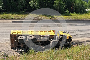 An overturned truck on an highway in an accident.