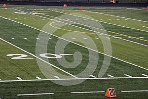 OVerview of 20 yard line on football field of local high school