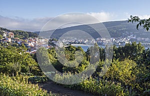 Overview of the buildings, the beach and the nature of Corcubion, a landmark village along the Camino de Santiago, Spain.