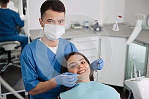 Overview of dental caries prevention. Girl at the dentist`s chair during a dental procedure. Healthy Smile