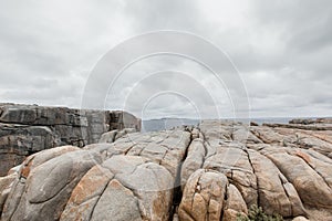 Overview of a gray rocky landscape with deeply worn cracks on the South coast of South Australia