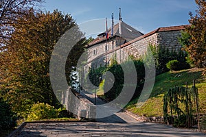 Overview of Lasko castle, rising above the city. Old castle in early morning sunlight, visible main entrance and its general