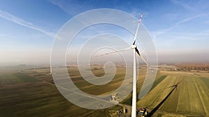 Overview of a lonely wind turbine in green meadow Poland