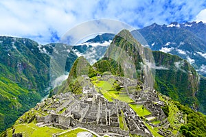 Overview of Machu Picchu, agriculture terraces and Wayna Picchu peak in the background