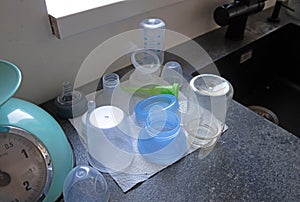 Overview of several sterilized bottles and cups for a baby