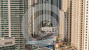 Overview to JBR and Dubai Marina skyline with modern high rise skyscrapers waterfront living apartments aerial timelapse