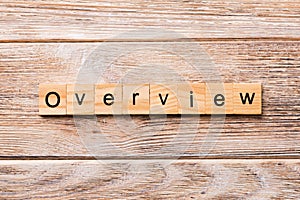 OVERVIEW word written on wood block. OVERVIEW text on wooden table for your desing, concept