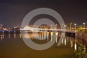 Overwater bridge over the sea at night in Macau