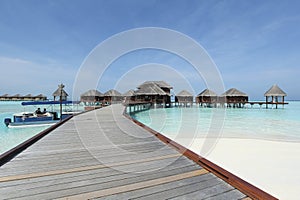 Overwater bungalows boardwalk in Maldives