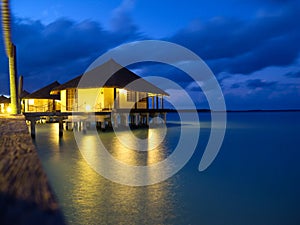 Overwater bungalows in tropical island