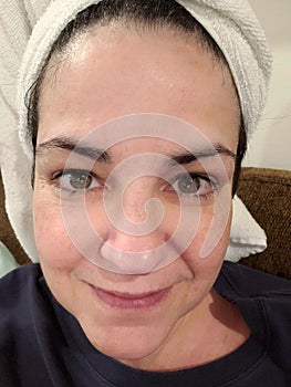 Overweight 54 Year Old Woman with Towel On Head No Makeup