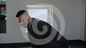 Overweight adult man warming up in the gym.