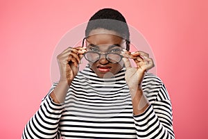 Overweight African Lady Wearing Eyeglasses Having Problems With Sight, Studio