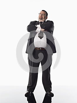 Overweight businessman standing with arms folded