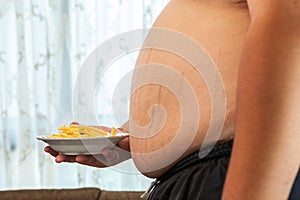 Overweight male with fast food