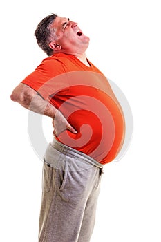 Overweight man with acute back ache bending over backwards to at