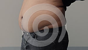 Overweight man closeup of belly