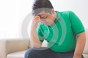 Overweight man depress thinking about his weight problem