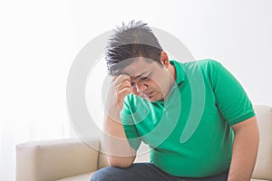 Overweight man depress thinking about his weight problem